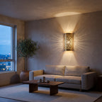 Pair of Sqala brass sconces beside a sofa in a modern living room