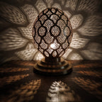 Close view of the lit Tamment lantern, points of light through perforated brass