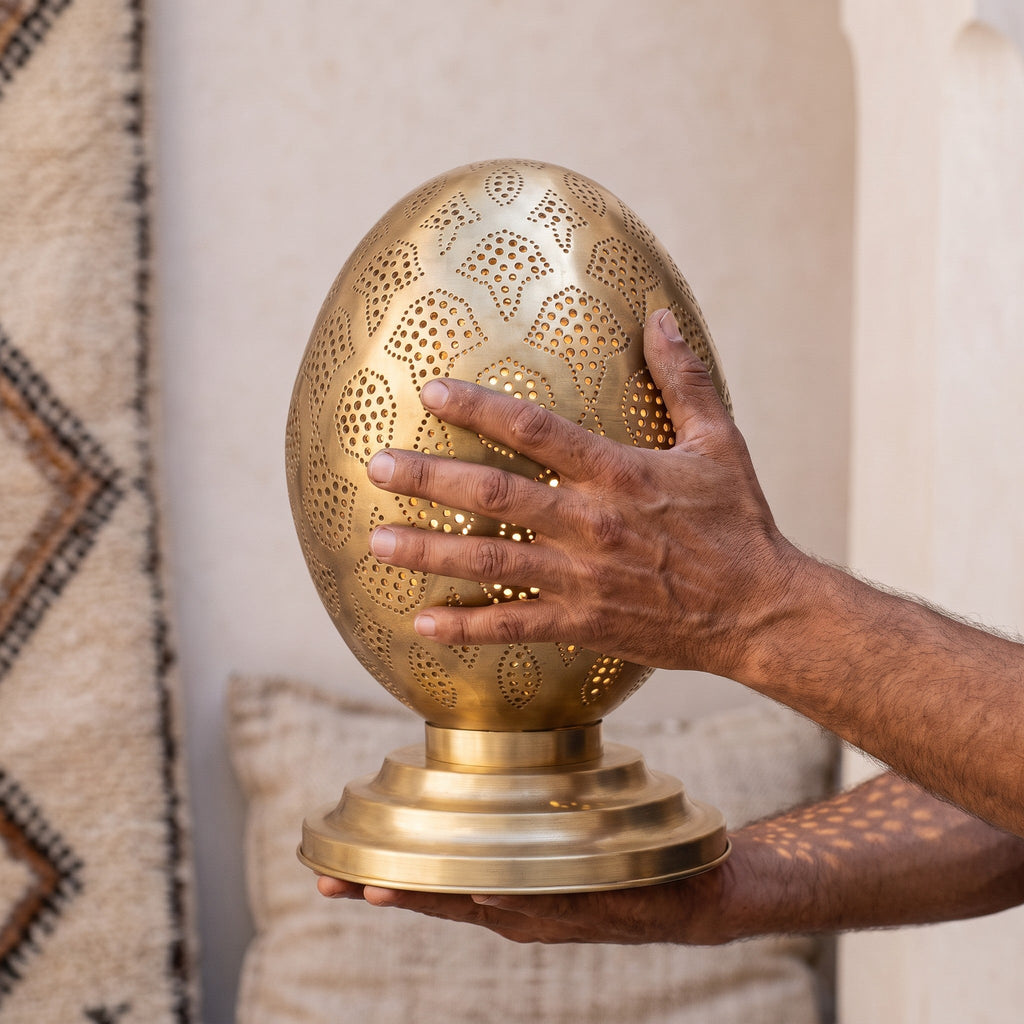 Maker's hands holding the Tamment lantern, unlit