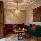 Tanirt pendant casting lace-like light in a Moroccan riad