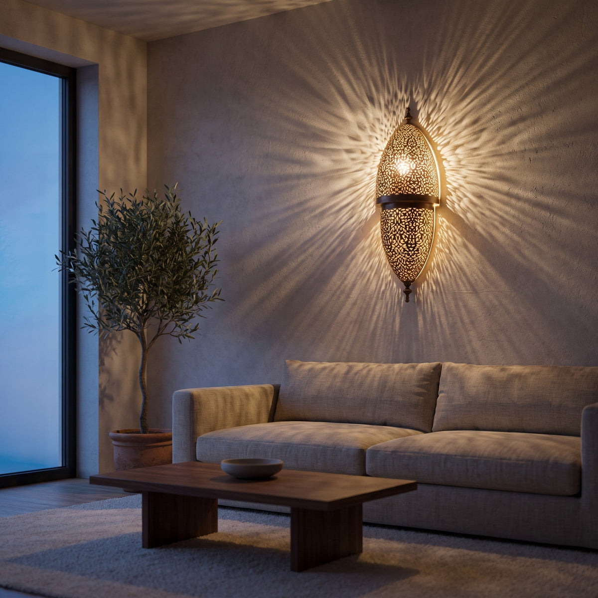 Tarz brass filigree sconce lit on a modern living room wall