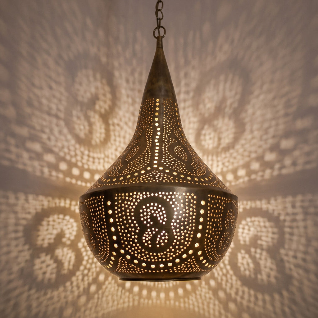 Detail of the lit Telouet pendant, wide piercings glowing brightly