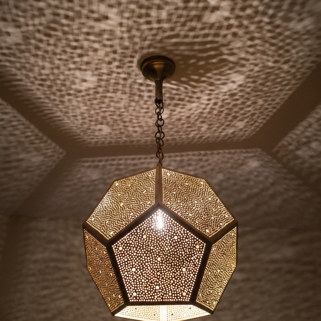 Close view of the lit Thouraya pendant, points of light on each facet