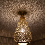 Detail of the lit Tichka dome, light passing through rows of hand-punched openings