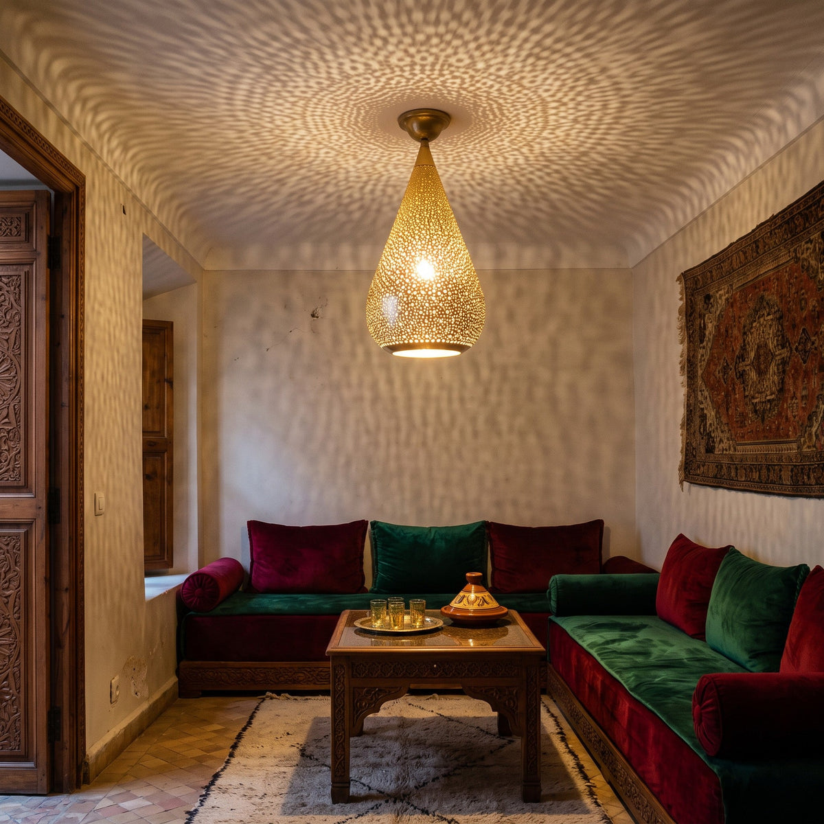 Tichka flush mount glowing on a riad ceiling at night, its pattern spread on the walls