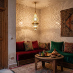 Toubkal pendant descending into a Moroccan riad courtyard, lit