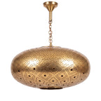 Tudert pierced brass pendant on a plain white studio background
