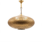 Warda pierced brass pendant lamp on a white studio background