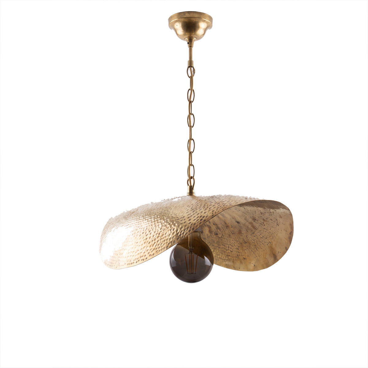 Warqa hammered brass leaf pendant light on a white studio background