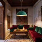 Zitoun verdigris copper pendant hanging in a Moroccan riad interior